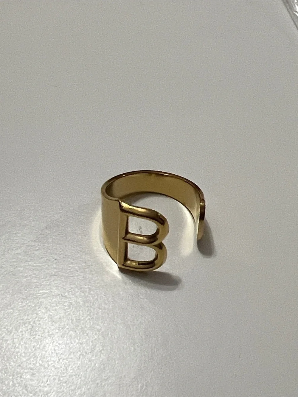 Plunder Gold tone B Initial Ring   Adjustable. Stainless steel
